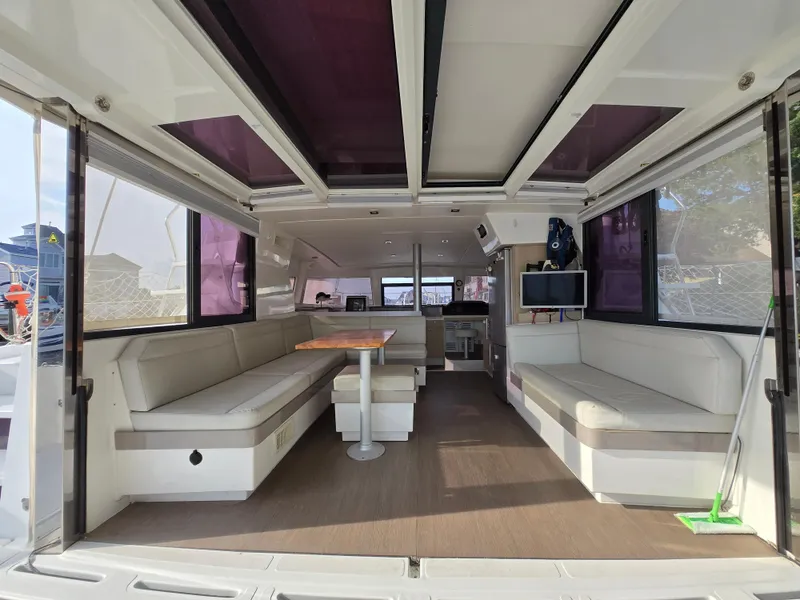 Slide: The Image of Spacious interior of a 2018 Bali 4.1 Catamaran with seating and modern amenities. - 12