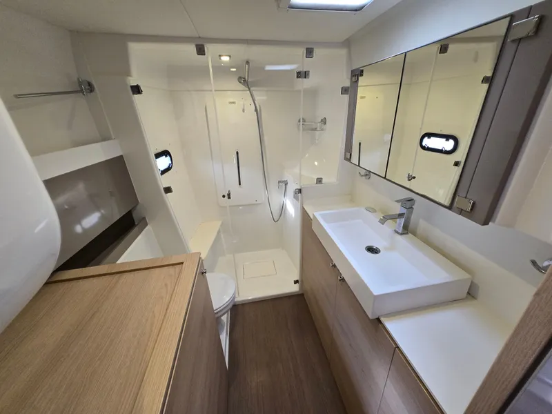 Slide: The Image of Modern bathroom interior on a 2018 Bali 4.1 Catamaran, featuring sleek fixtures and ample storage. - 19