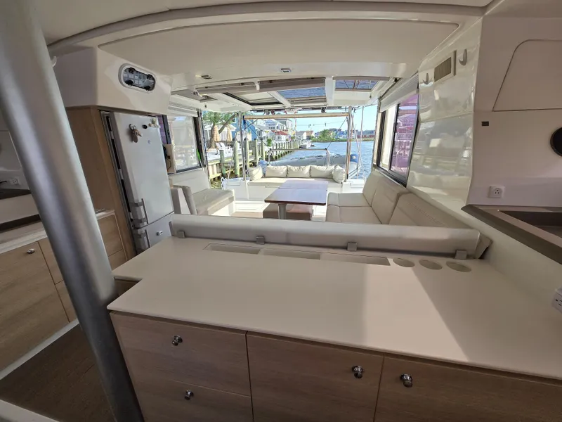 Slide: The Image of Interior of 2018 Bali 4.1 Catamaran with modern seating and waterfront view. - 3