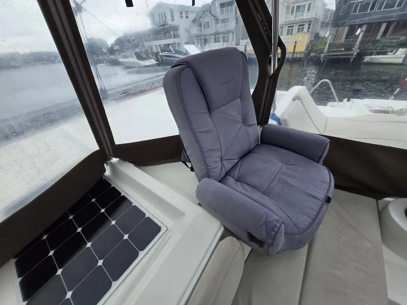 Slide: The Image of Comfortable seating on 2018 Bali 4.1 Catamaran with solar panel, docked near waterfront homes. - 31