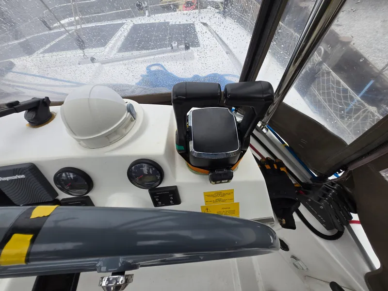 Slide: The Image of Cockpit view of a 2018 Bali 4.1 Catamaran with navigation instruments. - 33