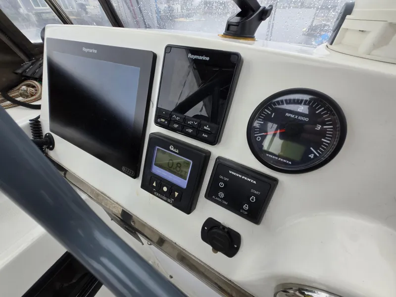 Slide: The Image of Control panel of a 2018 Bali 4.1 Catamaran with navigation and engine displays. - 34