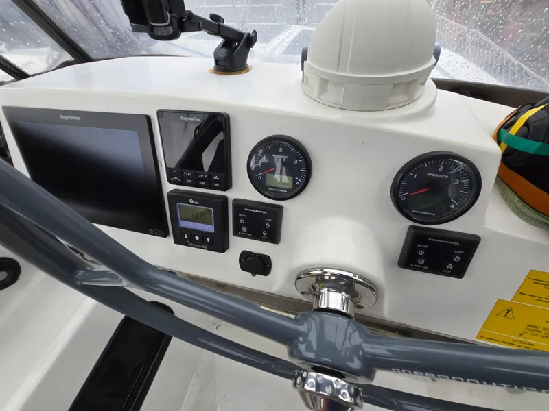 Slide: The Image of Control panel of a 2018 Bali 4.1 Catamaran with navigation instruments and gauges. - 35