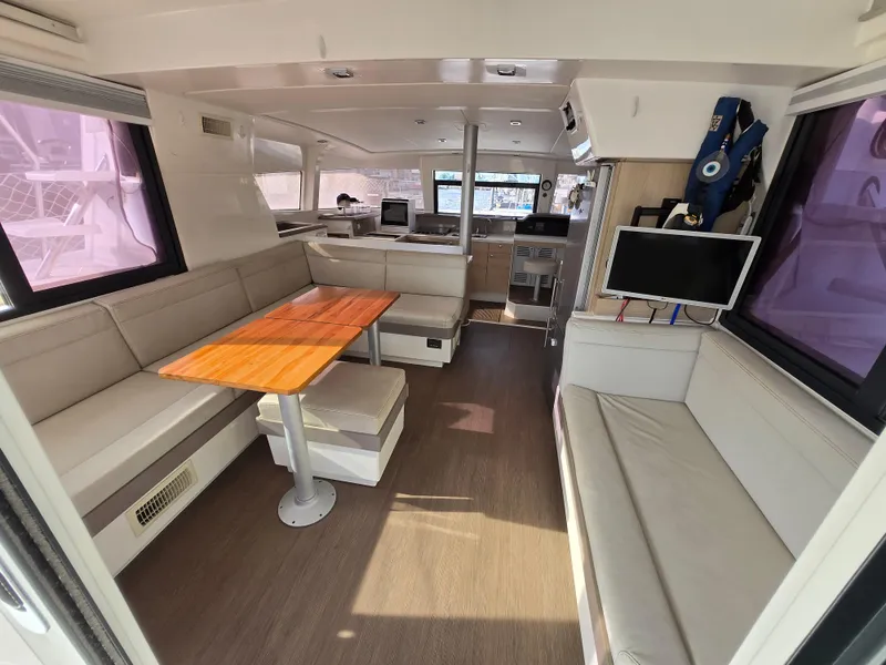 Slide: The Image of Interior of 2018 Bali 4.1 Catamaran with modern seating and dining area. - 39