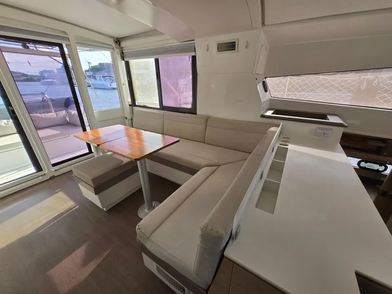 Slide: The Image of Interior of 2018 Bali 4.1 Catamaran with modern seating and dining area. - 44
