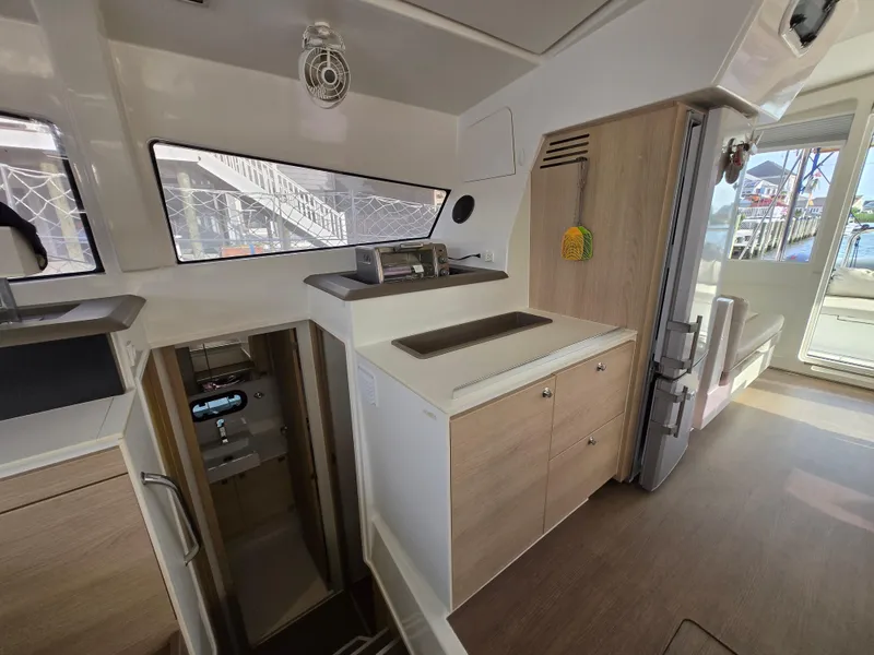 Slide: The Image of Interior of a 2018 Bali 4.1 Catamaran featuring a modern kitchen area. - 46