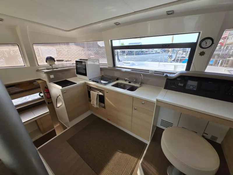 Slide: The Image of Interior of 2018 Bali 4.1 Catamaran kitchen with modern appliances and ample natural light. - 48