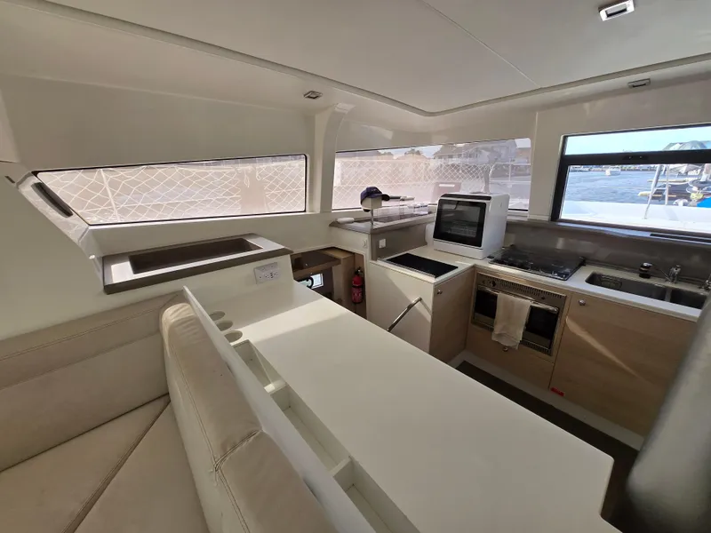 Slide: The Image of Interior of 2018 Bali 4.1 Catamaran kitchen with modern appliances and seating area. - 49