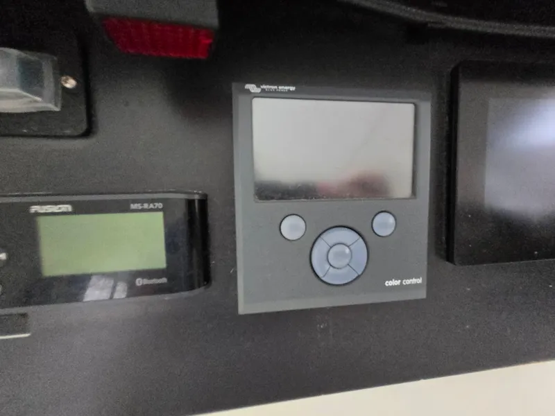 Slide: The Image of Control panel on a 2018 Bali 4.1 Catamaran, featuring a color display and buttons. - 70