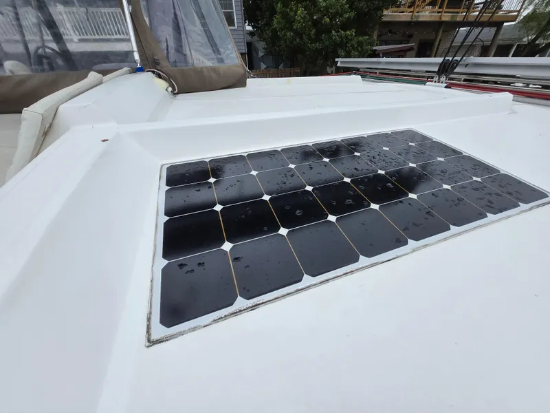 Slide: The Image of Solar panel on 2018 Bali 4.1 Catamaran deck, wet with raindrops. - 74