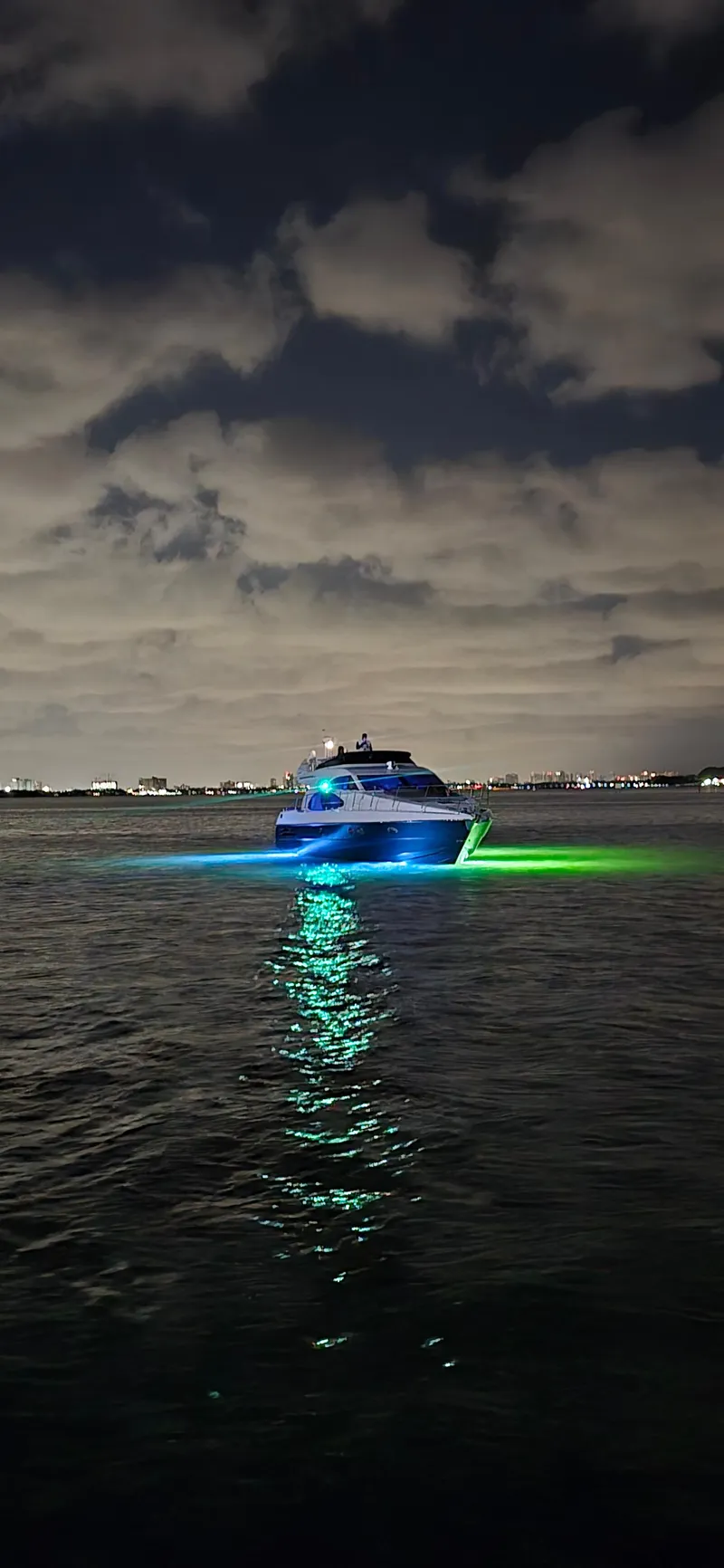 Slide: The Image of Azimut 54 yacht, 1997 model, illuminated at night on calm waters. - 10
