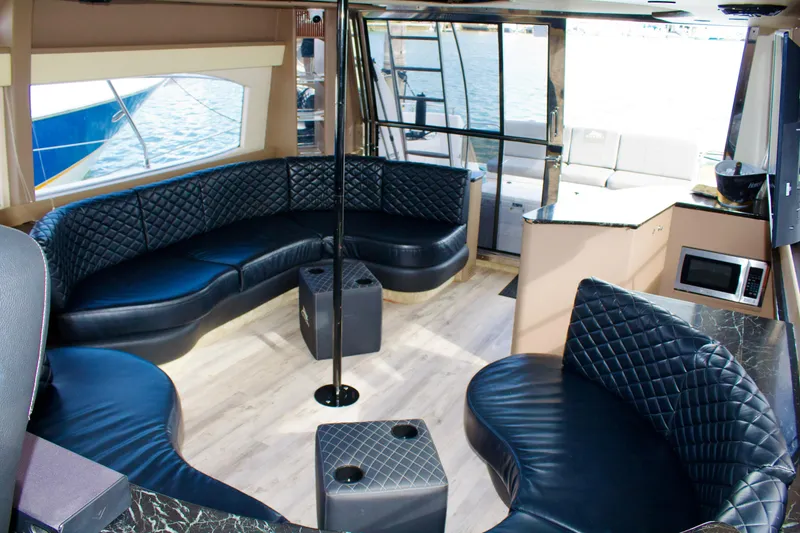 Slide: The Image of Luxurious interior of a 1997 Azimut 54 yacht with leather seating and modern amenities. - 15