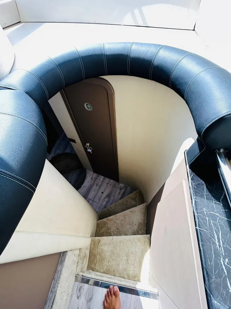 Slide: The Image of Staircase inside 1997 Azimut 54 yacht with plush carpeting and sleek design. - 17