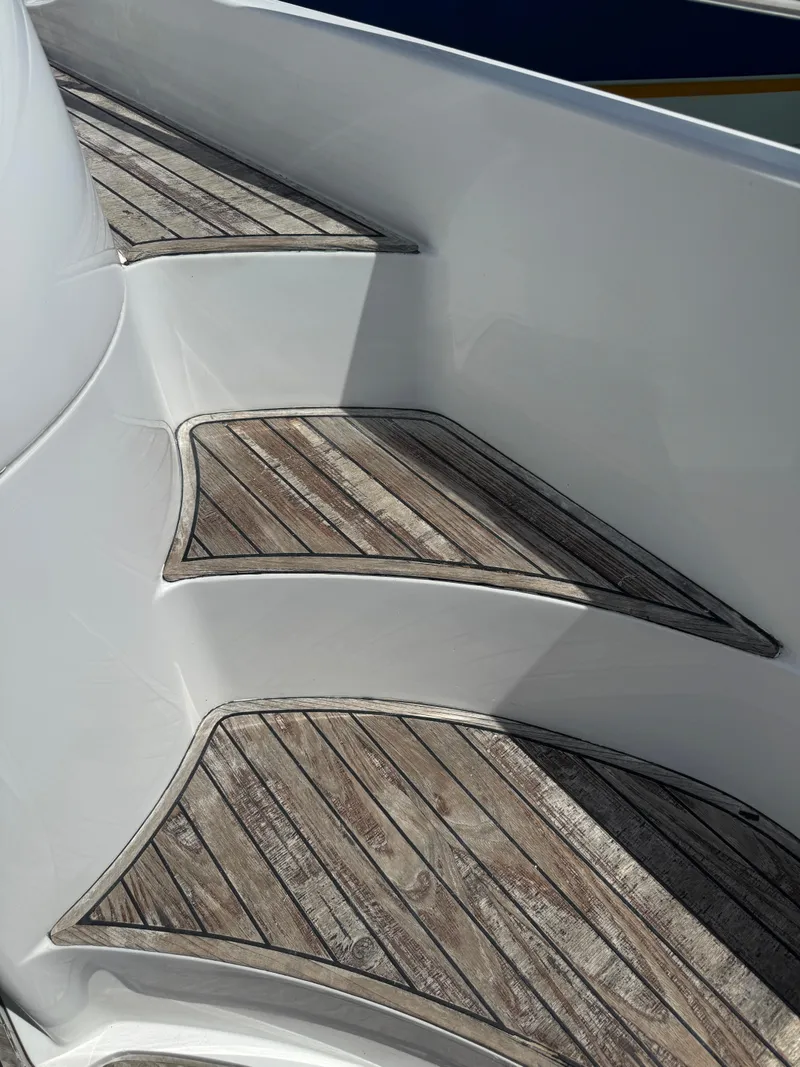 Slide: The Image of Wooden steps on a 1997 Azimut 54 yacht, showcasing elegant design and craftsmanship. - 38
