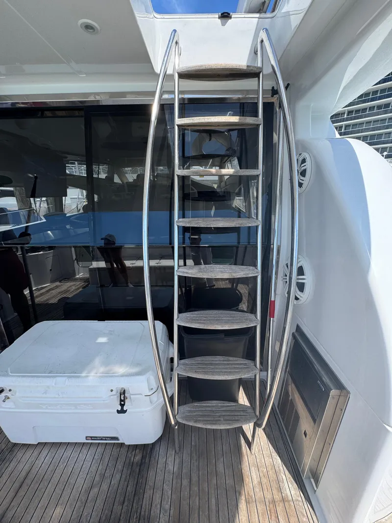 Slide: The Image of Stainless steel staircase on 1997 Azimut 54 yacht with wooden deck and white cooler. - 41