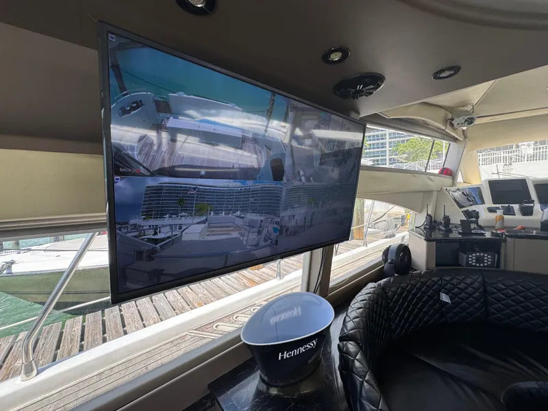 Slide: The Image of Interior of a 1997 Azimut 54 yacht with a large screen and luxury seating. - 42