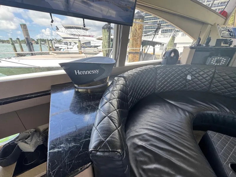 Slide: The Image of Luxurious interior of a 1997 Azimut 54 yacht with leather seating and Hennessy display. - 45