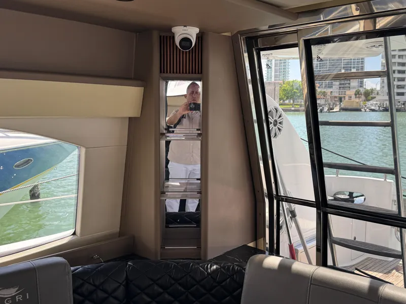 Slide: The Image of Interior of a 1997 Azimut 54 yacht with waterfront view and modern furnishings. - 47