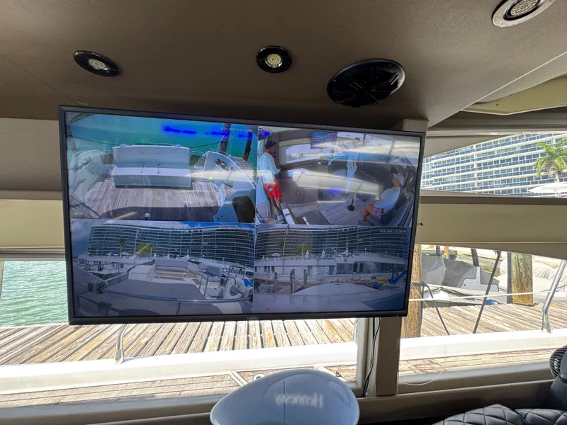 Slide: The Image of Interior view of a 1997 Azimut 54 yacht with a security monitor display. - 48