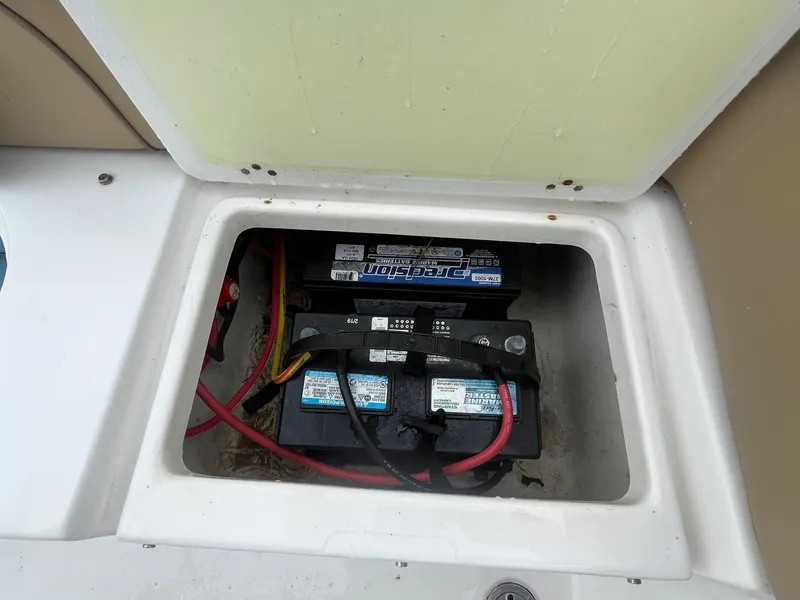 Slide: The Image of Battery compartment of 2017 Tidewater 230 LXF boat with visible wiring. - 13