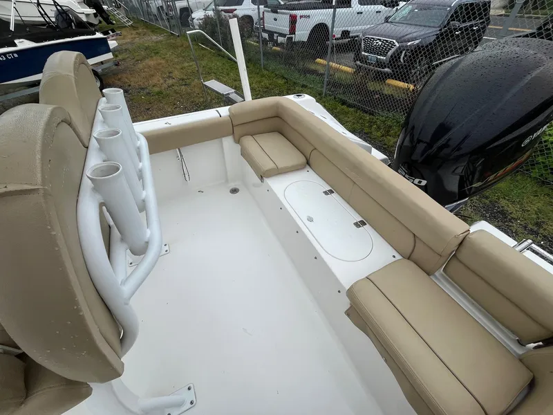Slide: The Image of 2017 Tidewater 230 LXF boat interior with beige seating and rod holders. - 25