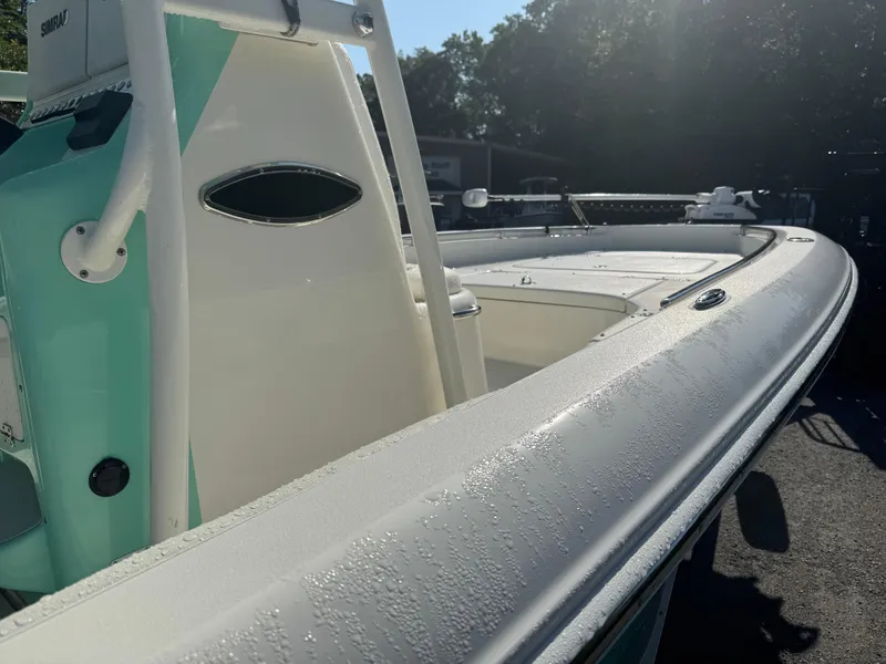 Slide: The Image of 2020 ShearWater 250 boat with sleek design and modern features, glistening in sunlight. - 16