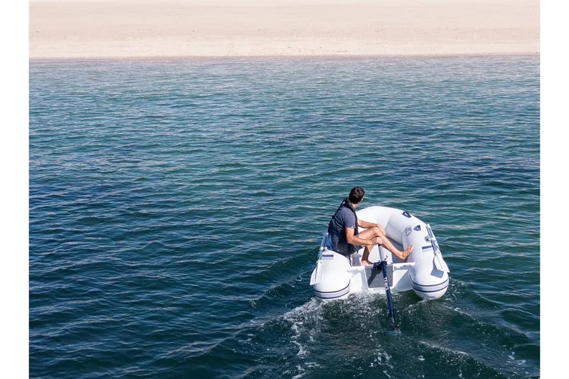 Slide: The Image of Highfield Roll-Up 230 KAM boat on open water, 2026 model. - 8