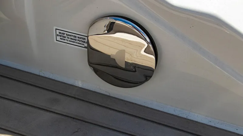 Slide: The Image of 2023 Crownline 290 XSS boat water intake port with chrome finish. - 23