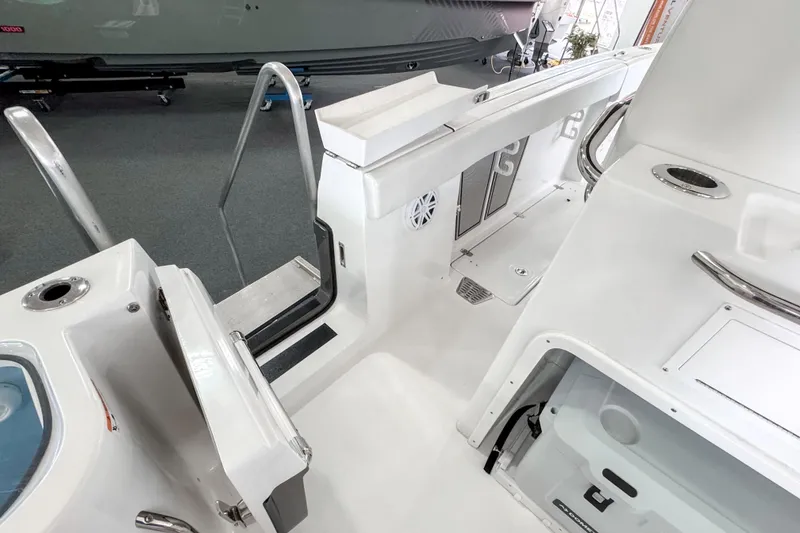 Slide: The Image of 2024 Wellcraft 263 Fisherman boat interior, featuring sleek white design and modern amenities. - 23