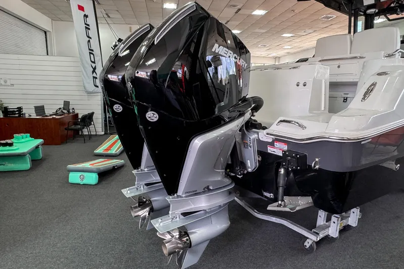 Slide: The Image of 2024 Wellcraft 263 Fisherman boat with dual Mercury outboard engines in showroom. - 4