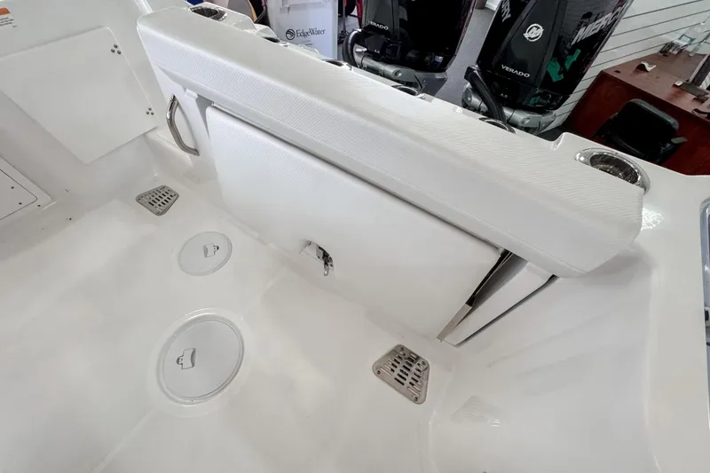 Slide: The Image of 2024 Wellcraft 263 Fisherman boat interior with seating and storage compartments. - 6