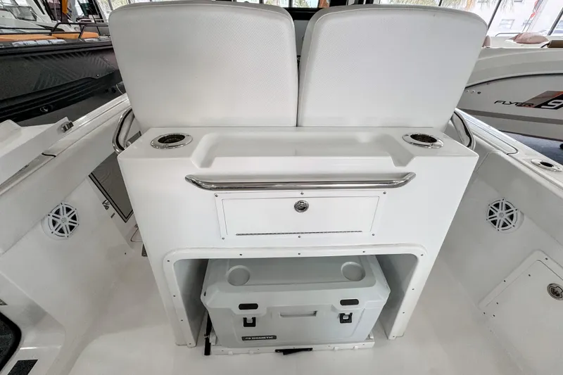 Slide: The Image of 2024 Wellcraft 263 Fisherman boat interior with seating and storage area. - 8