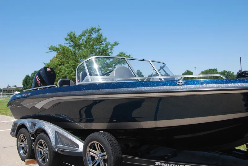 Slide: The Image of 2025 Ranger 620FS Cup Equipped boat on trailer, outdoors, sunny day. - 1