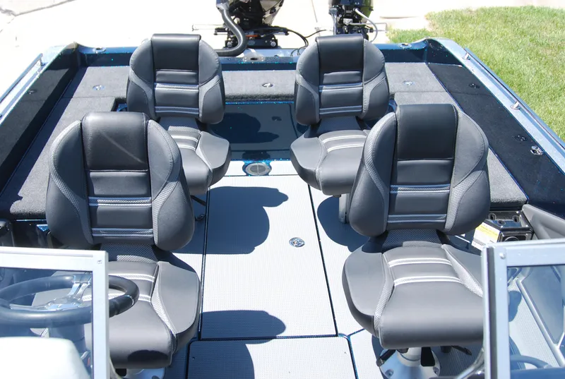Slide: The Image of 2025 Ranger 620FS Cup Equipped boat interior with four black cushioned seats. - 3