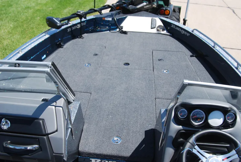 Slide: The Image of 2025 Ranger 620FS Cup Equipped boat interior with steering console and spacious deck. - 4