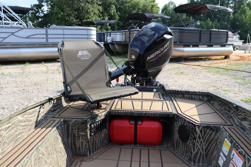 Slide: The Image of 2025 Tracker Grizzly 1650 T Prairie Wings Edition boat with Mercury engine and camo design. - 4