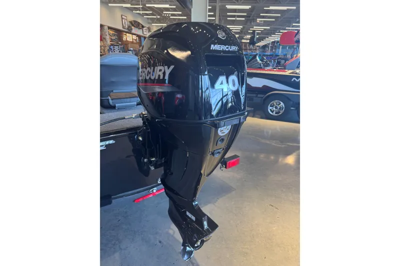 Slide: The Image of 2025 Tracker Panfish 17 with Mercury 40 outboard motor in showroom. - 2