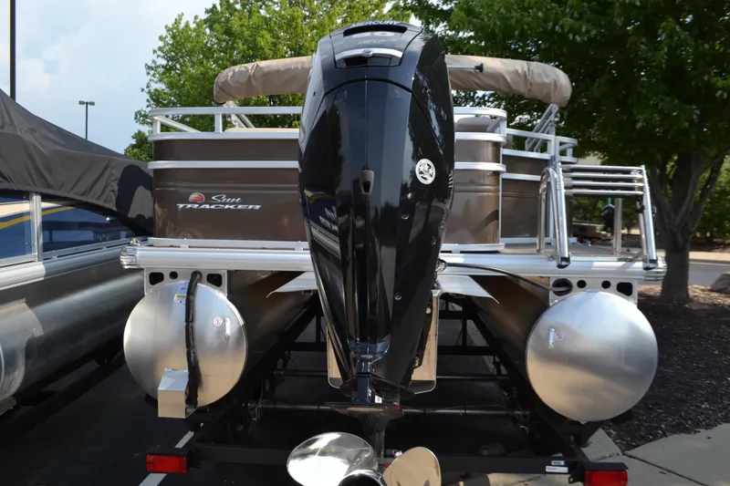 Slide: The Image of 2025 Sun Tracker SportFish 20 DLX pontoon boat with Mercury outboard motor. - 2