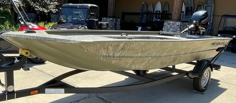 The Image of 2025 Tracker Grizzly 1654 T Sportsman boat on trailer, outdoor display. - 0