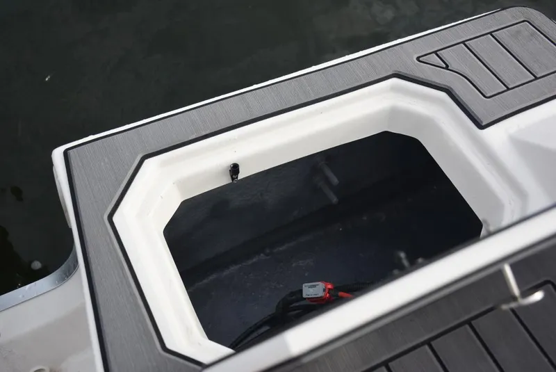 Slide: The Image of Starcraft SVX 171 boat storage compartment, 2025 model, with open hatch and visible interior. - 14