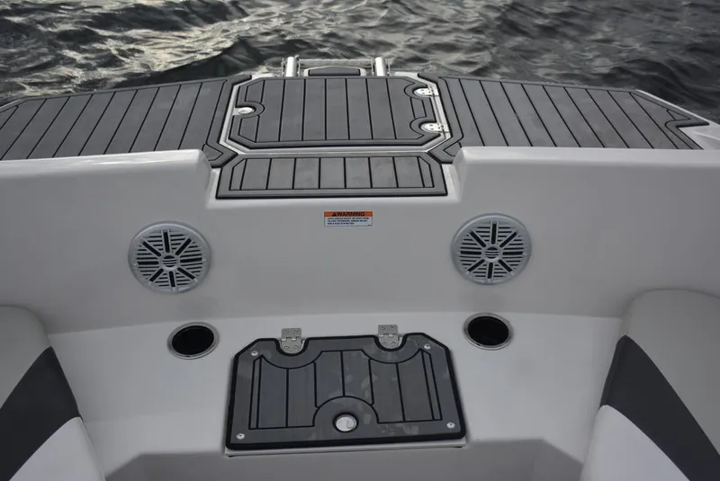 Slide: The Image of 2025 Starcraft SVX 171 boat deck with speakers and storage compartments. - 5