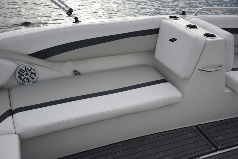 Slide: The Image of 2025 Starcraft SVX 171 boat interior with cushioned seating and cup holders. - 8