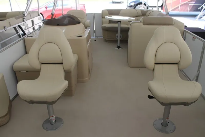 Slide: The Image of Interior of 2025 Starcraft EX 18 boat with beige seating and modern design. - 10