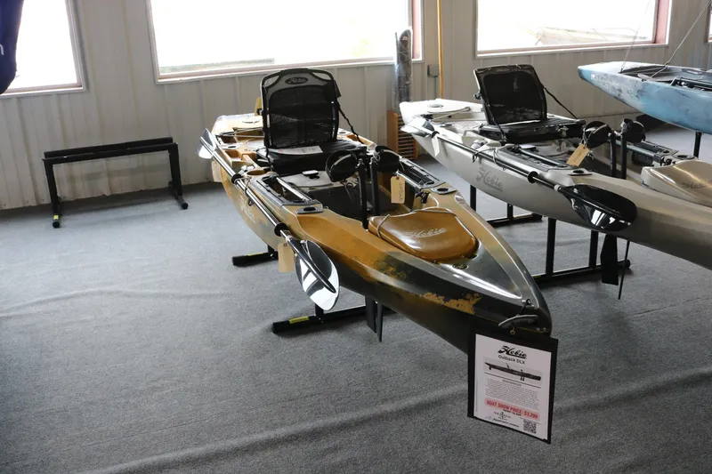 The Image of 2024 Hobie Mirage Outback kayak displayed indoors on a stand. - 2
