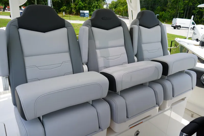 Slide: The Image of 2025 Robalo R300 Center Console boat seats, featuring luxurious gray upholstery and ergonomic design. - 29