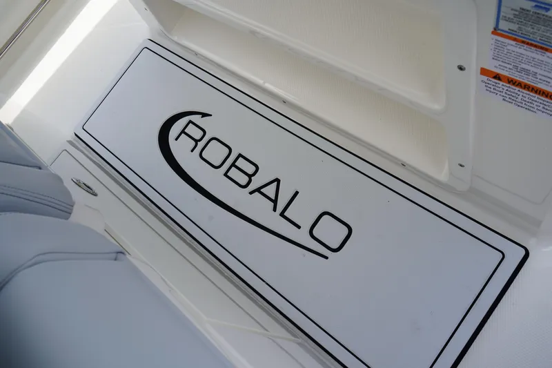 Slide: The Image of 2025 Robalo R300 Center Console boat interior with logo detail. - 31