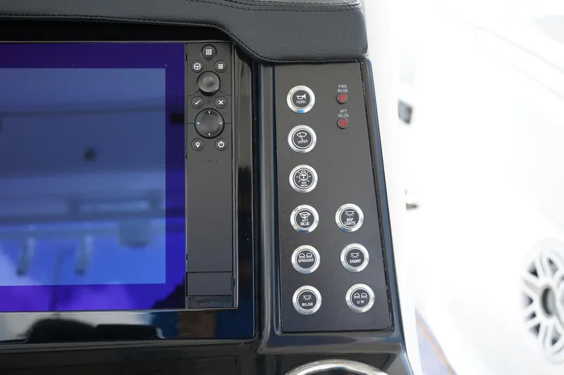 Slide: The Image of 2025 Robalo R300 Center Console dashboard with control buttons and display screen. - 40