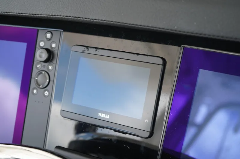 Slide: The Image of 2025 Robalo R300 Center Console dashboard with Yamaha display and controls. - 42