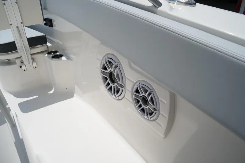 Slide: The Image of 2025 Robalo R300 Center Console boat interior with speakers and seating. - 45