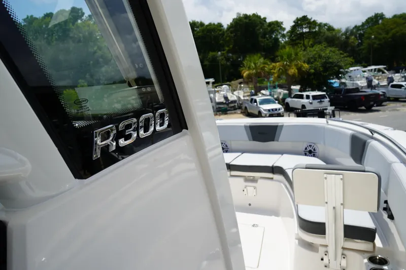 Slide: The Image of 2025 Robalo R300 Center Console boat, featuring sleek design and spacious seating. - 46